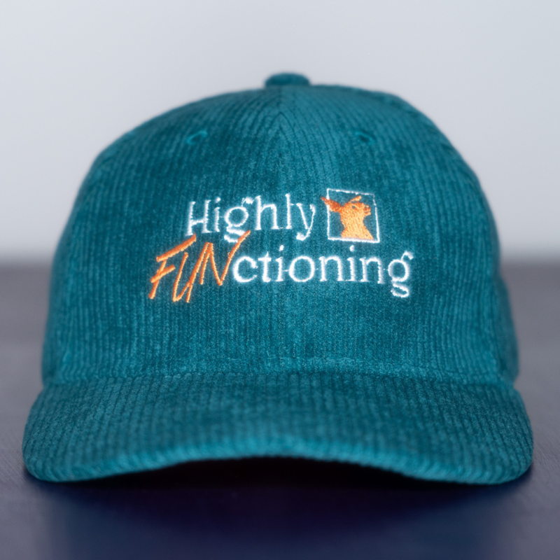 A teal colored corduroy baseball cap with 'Highly FUNctioning' and a kangaroo embroidered in white and orange on the front.